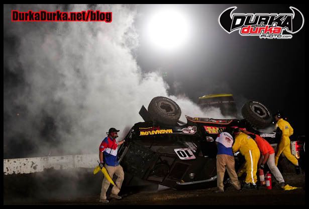 Crews attend to Greg Adler after crashing in turn 5 during Round 7.