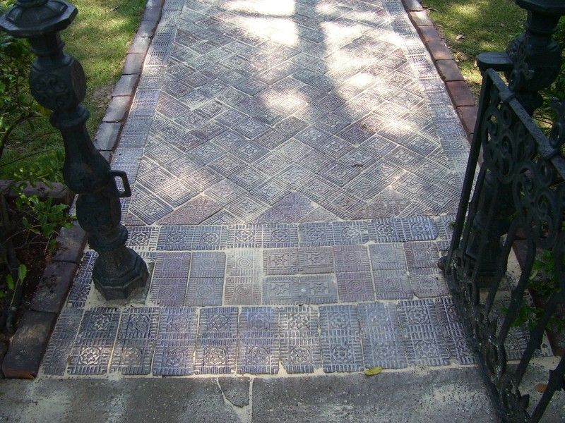 http://i43.photobucket.com/albums/e386/brickpaver/front%20walk%20soaking%20in%20sand.jpg 
