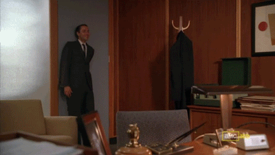 an animated image of the character Pete from Mad Men, running stimmily around a room